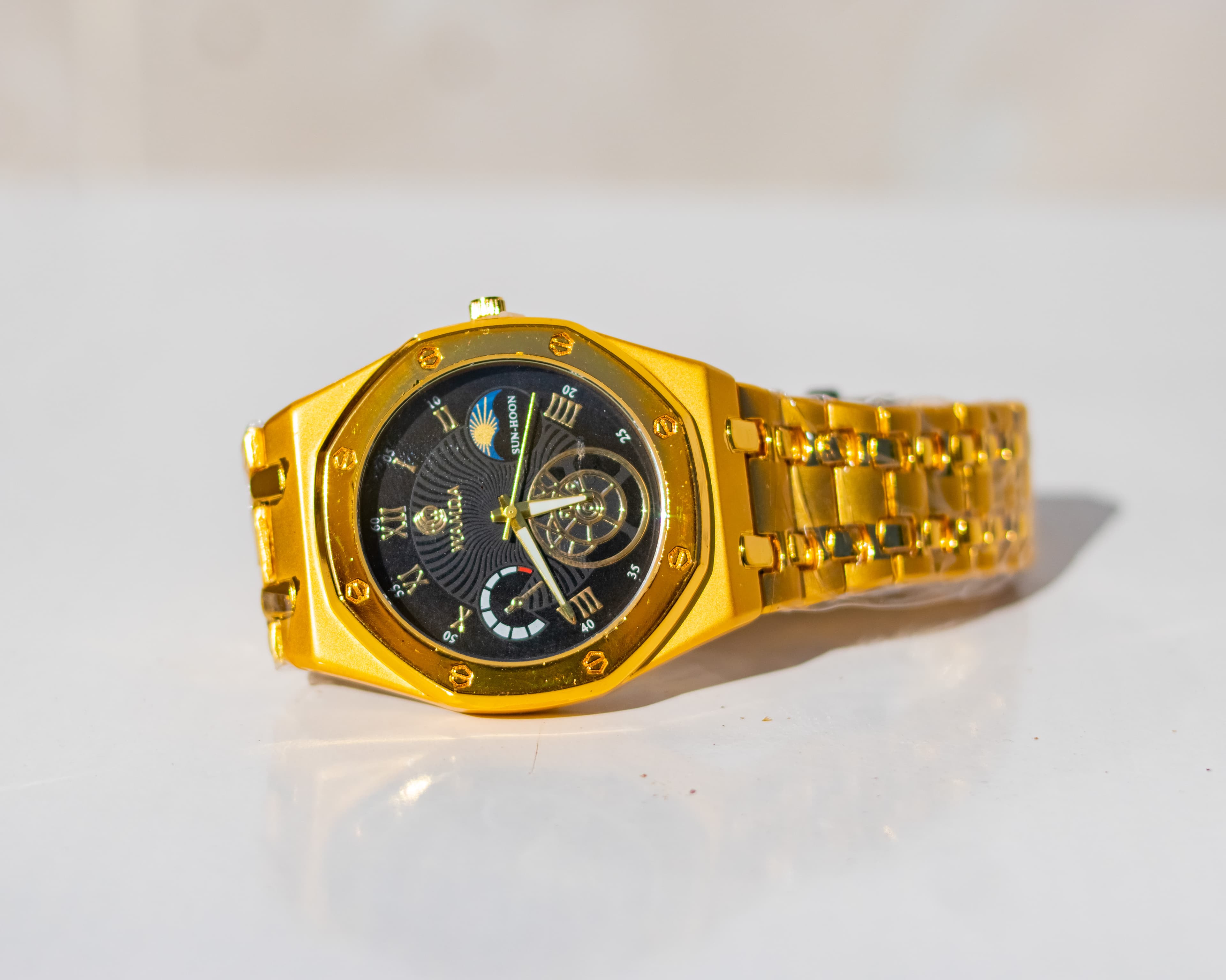 Gold octagonal black dial wristwatch