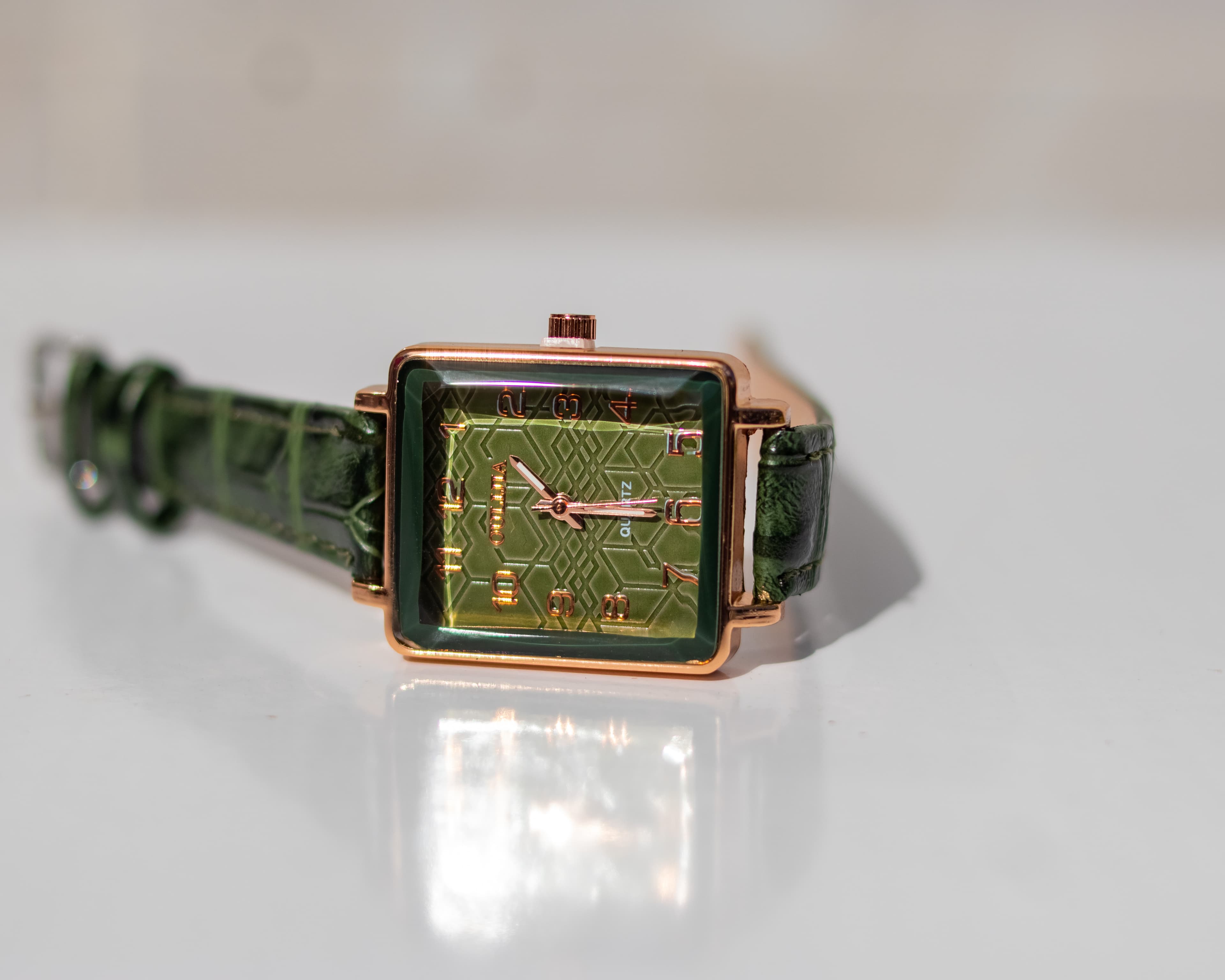 Rose-gold square shaped wrist watch