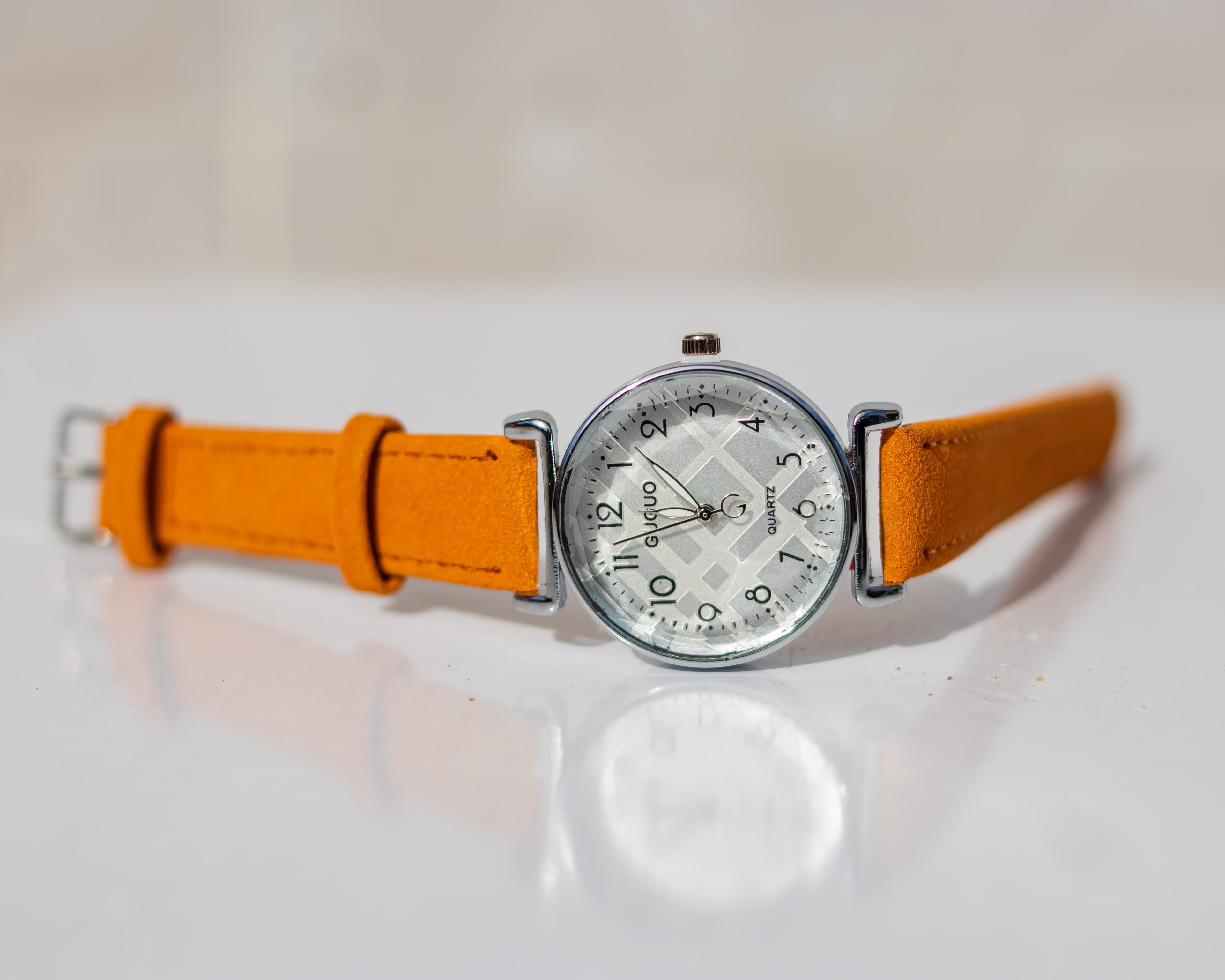 Crystal studded dial wristwatch with a yellow leather strap