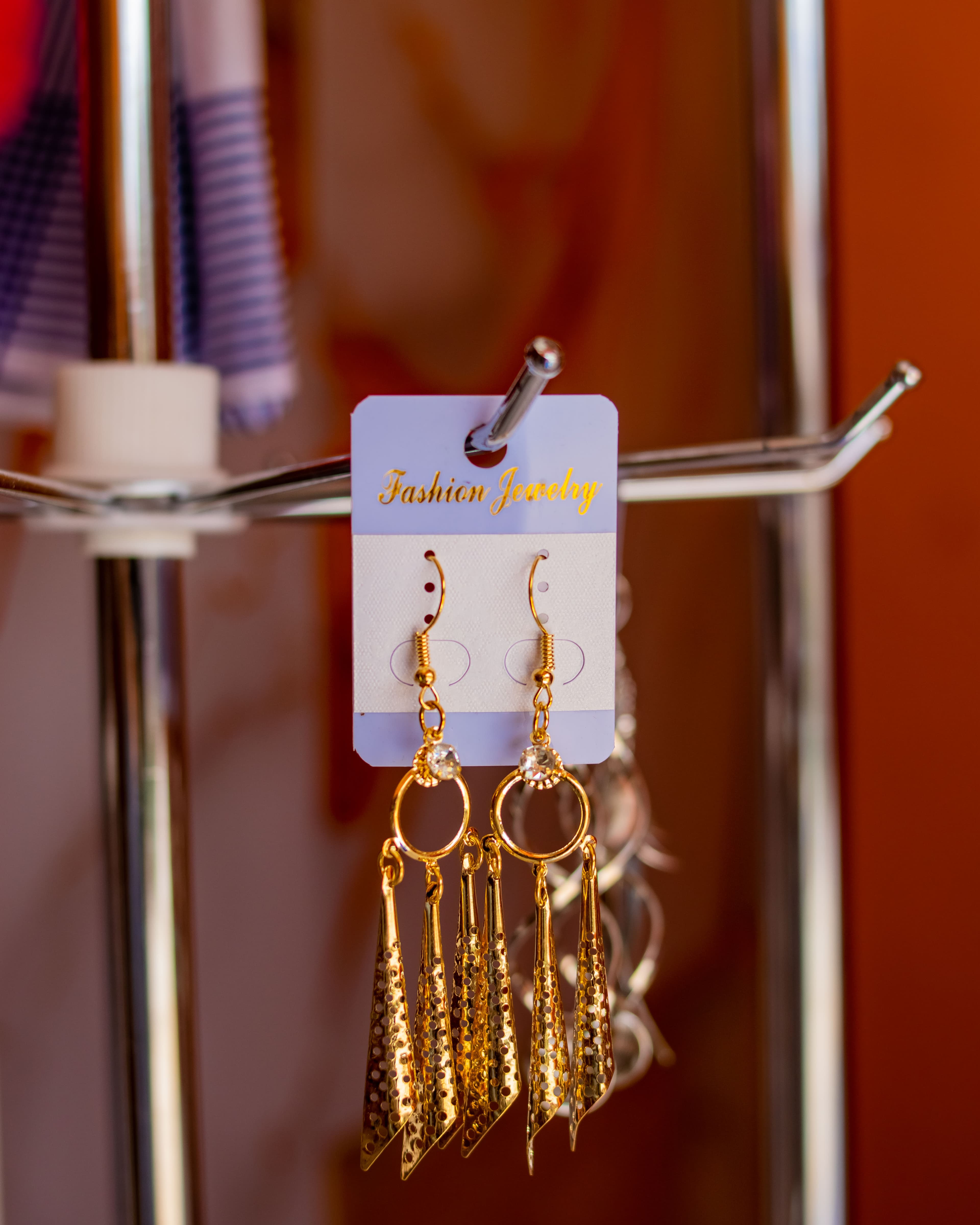 Golden-cone shaped dangling earrings