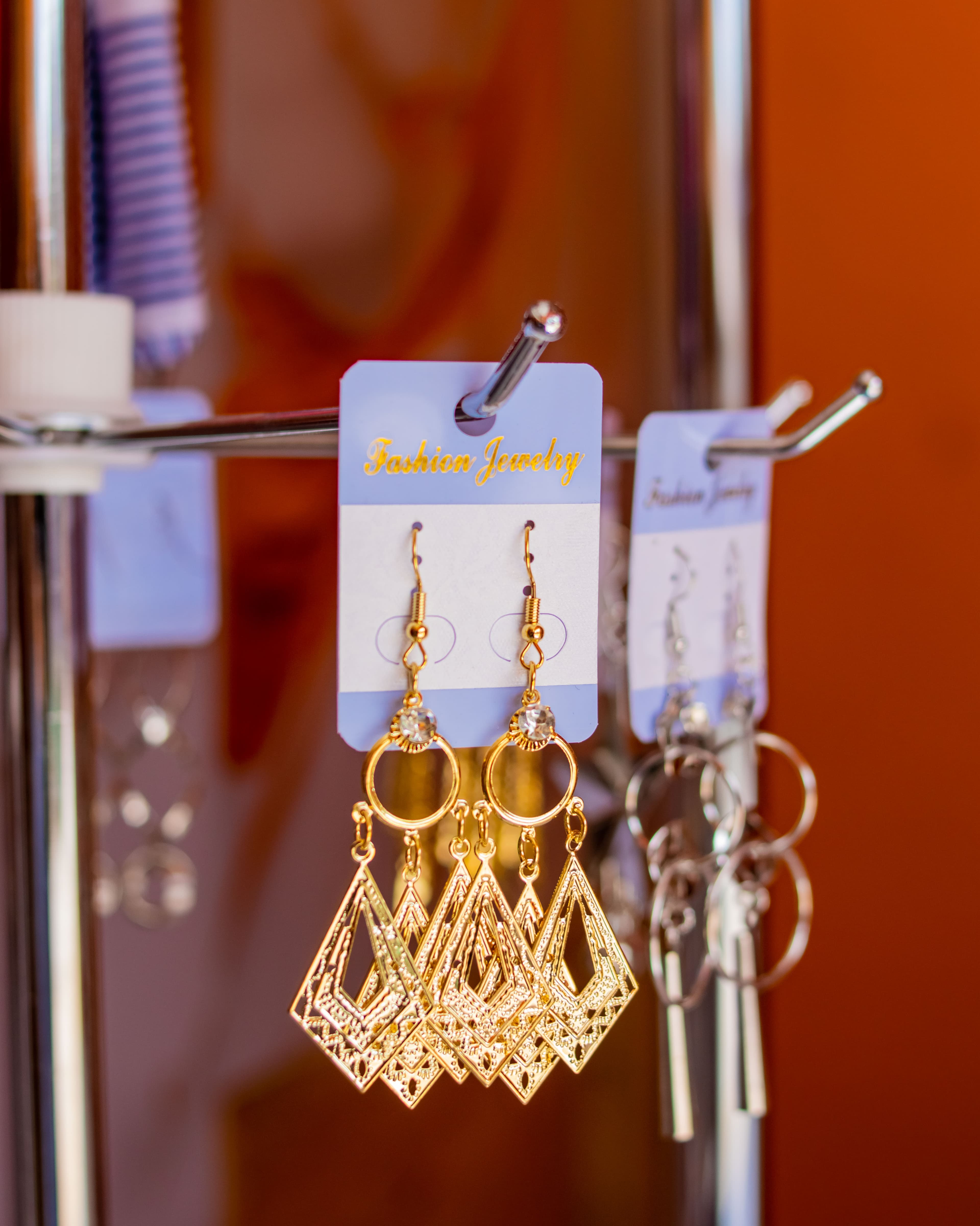 Golden pyramidal dangling earrings