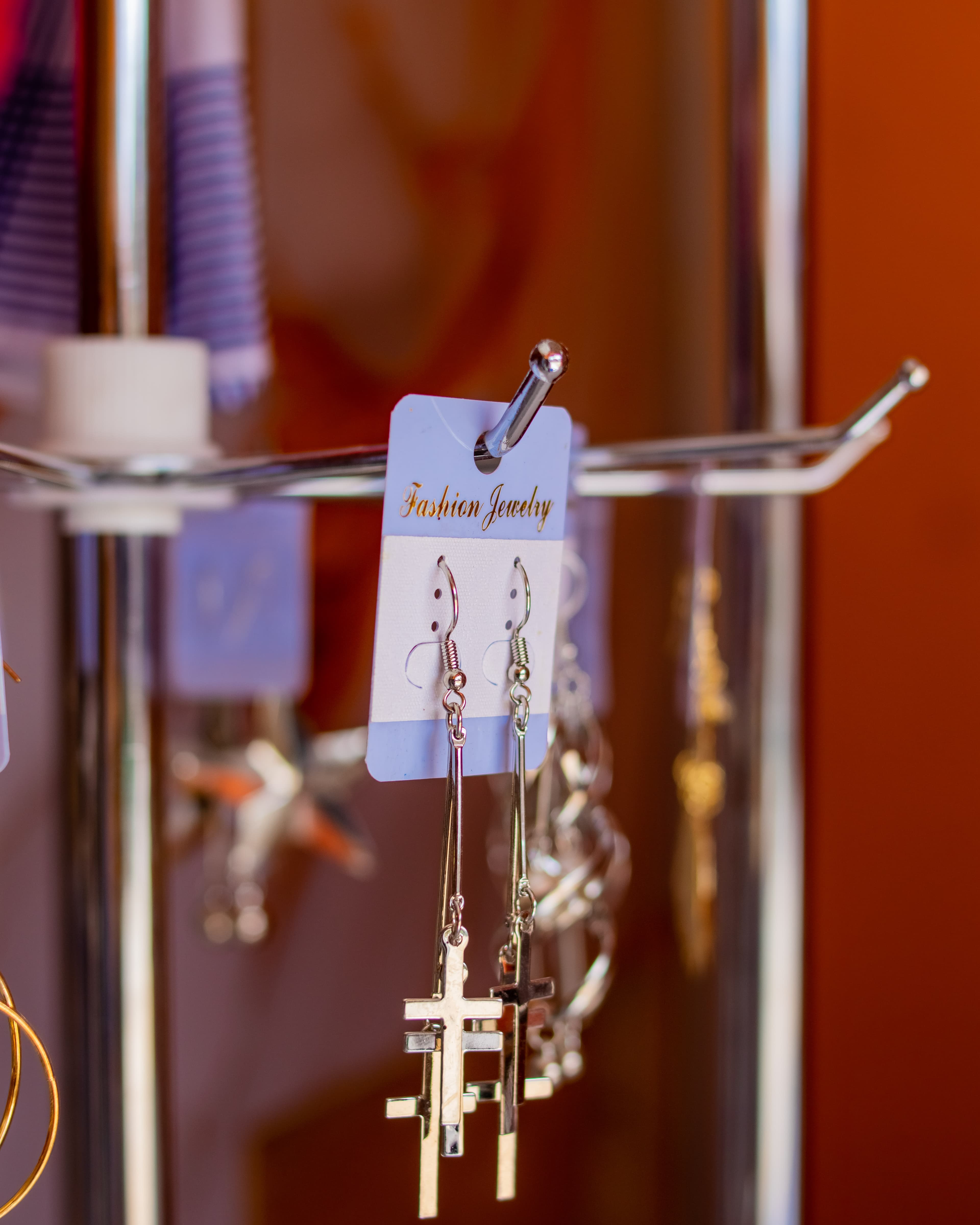 Silver cross dangling earrings